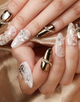 BEYONDCANVA Winter Elegance nail set featuring a pearl necklace design, sparkling snowflake accents, and an elegant bow, combining festive charm with sophisticated style—perfect for any winter gathering.