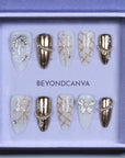 BEYONDCANVA Winter Elegance nail set featuring a pearl necklace design, sparkling snowflake accents, and an elegant bow, combining festive charm with sophisticated style—perfect for any winter gathering.