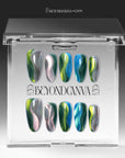 Green blue chrome press-on nails arranged in a flat lay