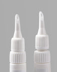 Close-up detail of two Beyondcanva glue remover pen nozzles on a gray background