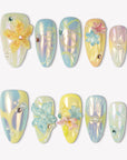 Iridescent Petals pastel yellow, blue and green press-on nails with raised flowers, pearls and gem accents