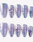 Moonwave blue and purple iridescent press-on nails with pearl accents and raised wave details