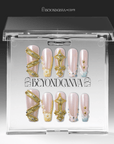 Packaging display of Opal Dynasty press-on nails in a clear Beyondcanva case with nude pink bases, gold crown accents, pearls, and rhinestones