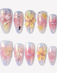 Pastel Bloom pink and blue press-on nails with raised yellow flowers, pearls and silver bead accents