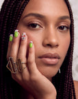 Pastel Dream handmade press-on nails worn in a close-up portrait with lime green nails and jeweled accents