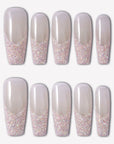 Pink Confetti press-on nails with sheer nude pink square bases and sparkling pink silver glitter French tips in a confetti gradient