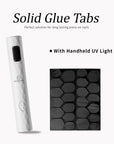 Beyondcanva solid glue tabs sheet paired with a white handheld UV light for press-on nail application