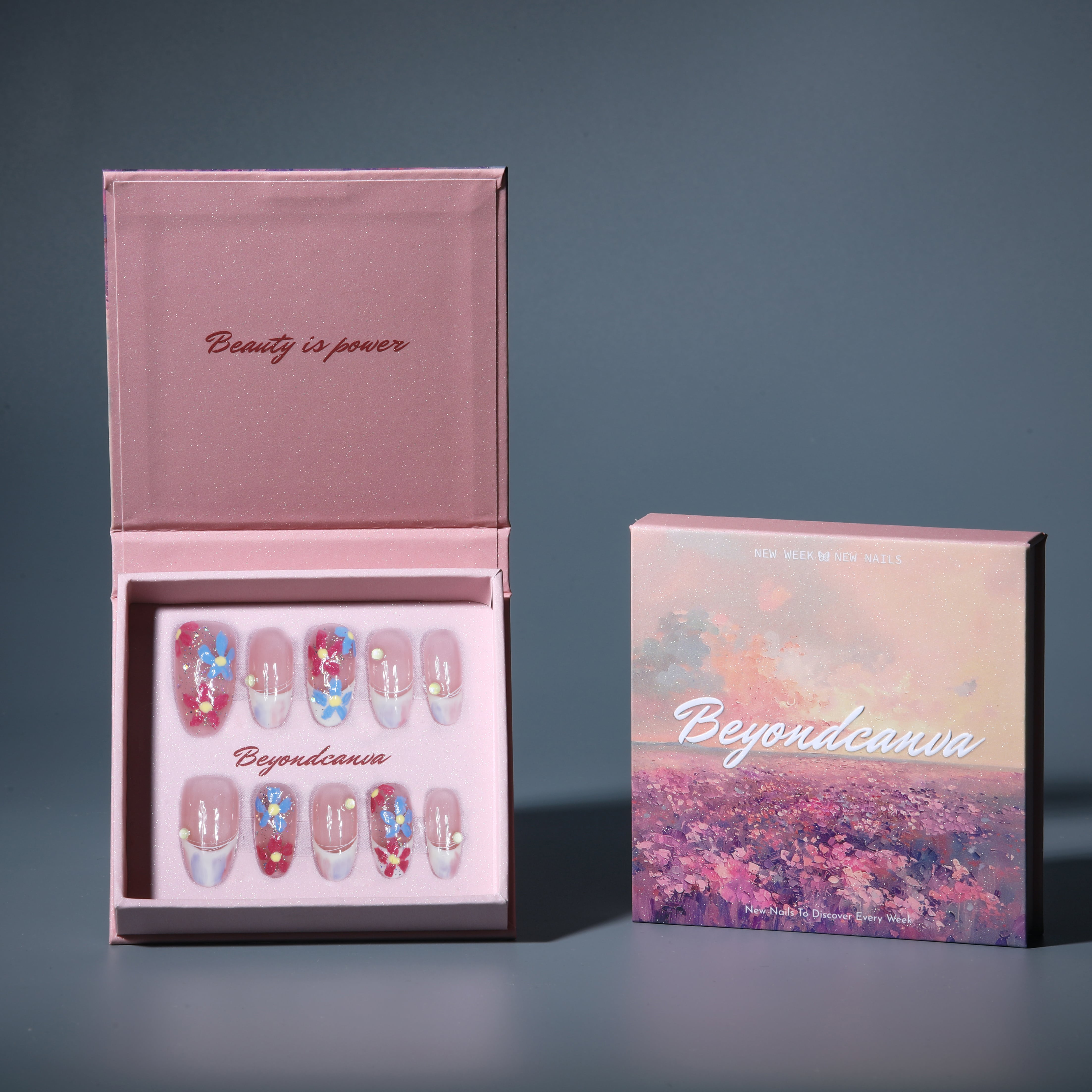 Beyondcanva press-on nails featuring colorful floral accents on a soft pink base, ideal for a chic and feminine style.