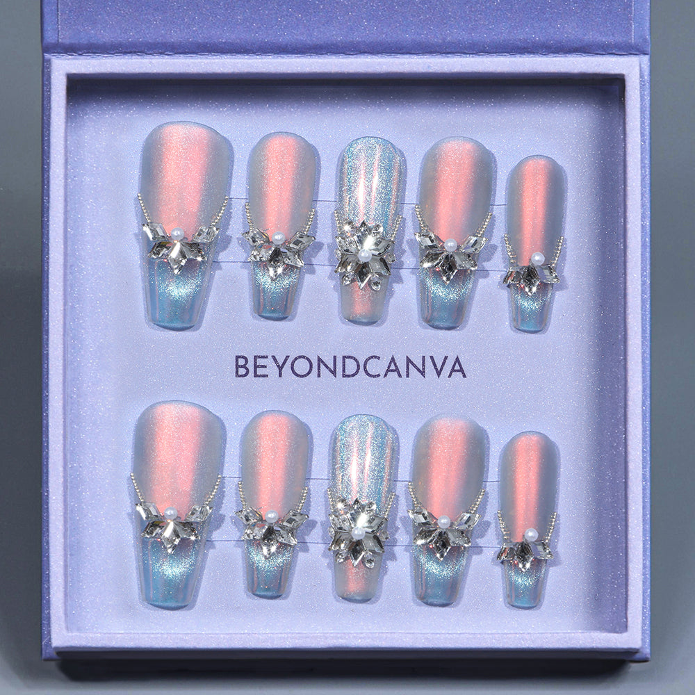 BEYONDCANVA press-on nails in a purple box, featuring shimmery pink and blue designs with 3D pearl and rhinestone accents.