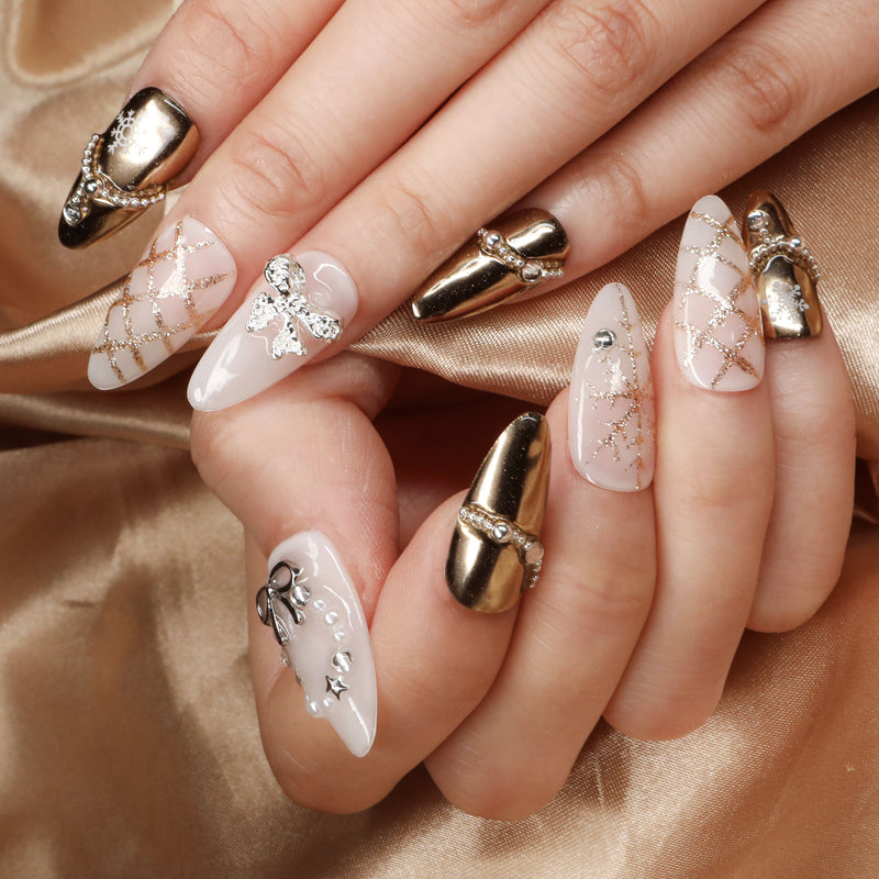 BEYONDCANVA Winter Elegance nail set featuring a pearl necklace design, sparkling snowflake accents, and an elegant bow, combining festive charm with sophisticated style—perfect for any winter gathering.