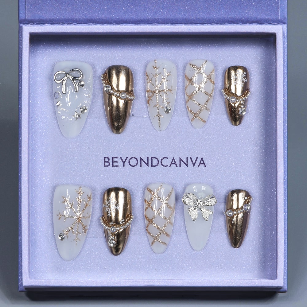 BEYONDCANVA Winter Elegance nail set featuring a pearl necklace design, sparkling snowflake accents, and an elegant bow, combining festive charm with sophisticated style—perfect for any winter gathering.