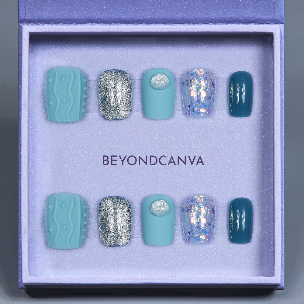 Beyondcanva blue-themed press-on nails featuring unique textures, glitter accents, and a vibrant, bold design.