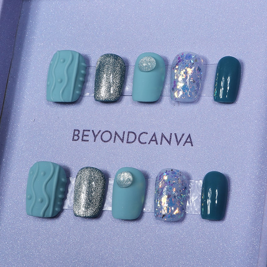 Beyondcanva blue-themed press-on nails featuring unique textures, glitter accents, and a vibrant, bold design.