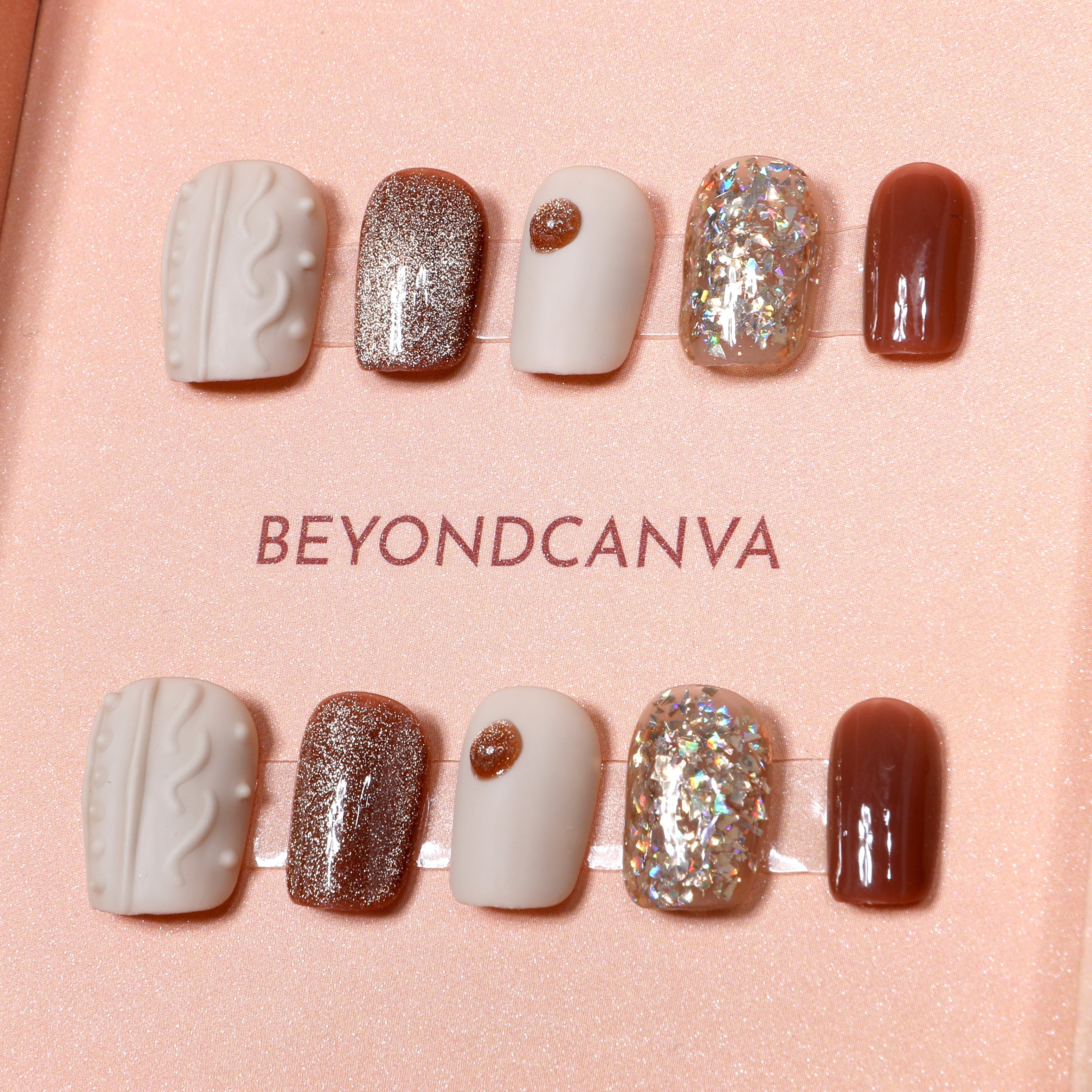 Beyondcanva's press-on nails set featuring elegant beige, glittery rose gold, and shimmering accents, perfect for a chic look.