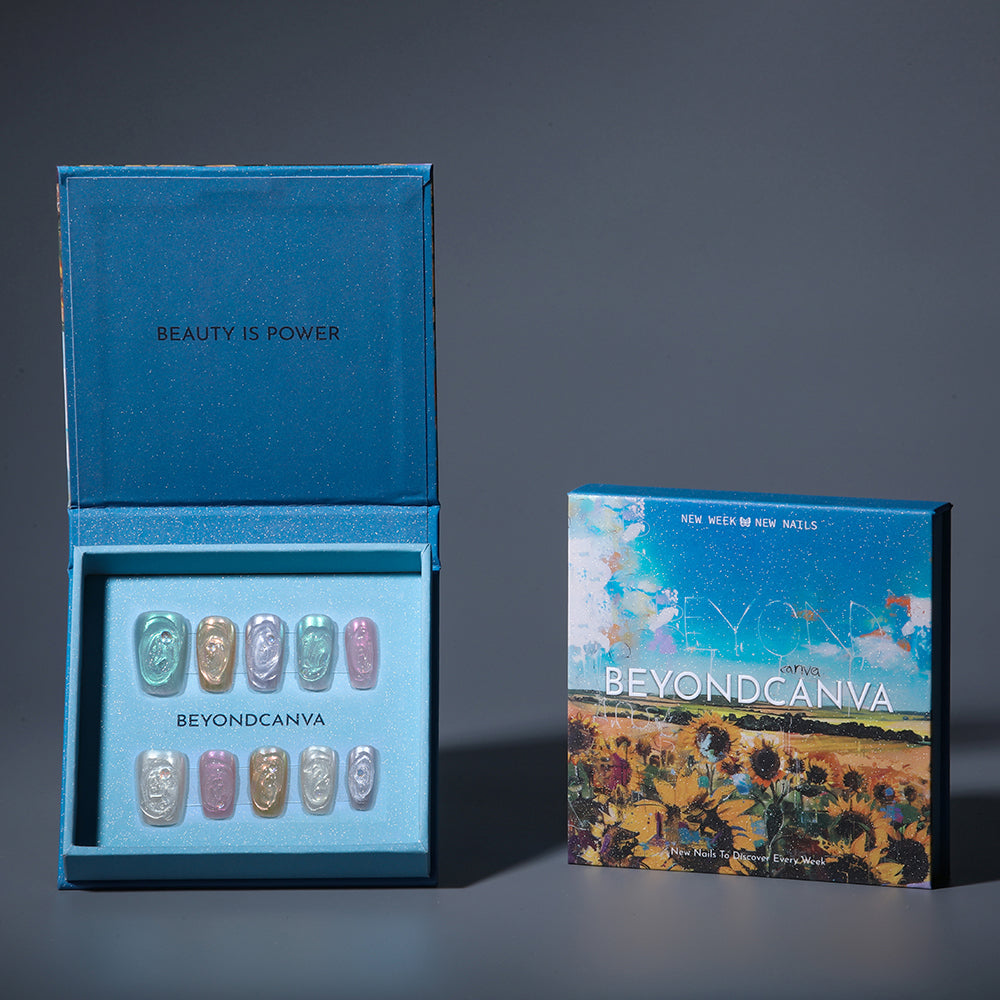 BEYONDCANVA pastel press-on nails set featuring a variety of shimmery colors with a marble effect and rhinestone accents, elegantly boxed.