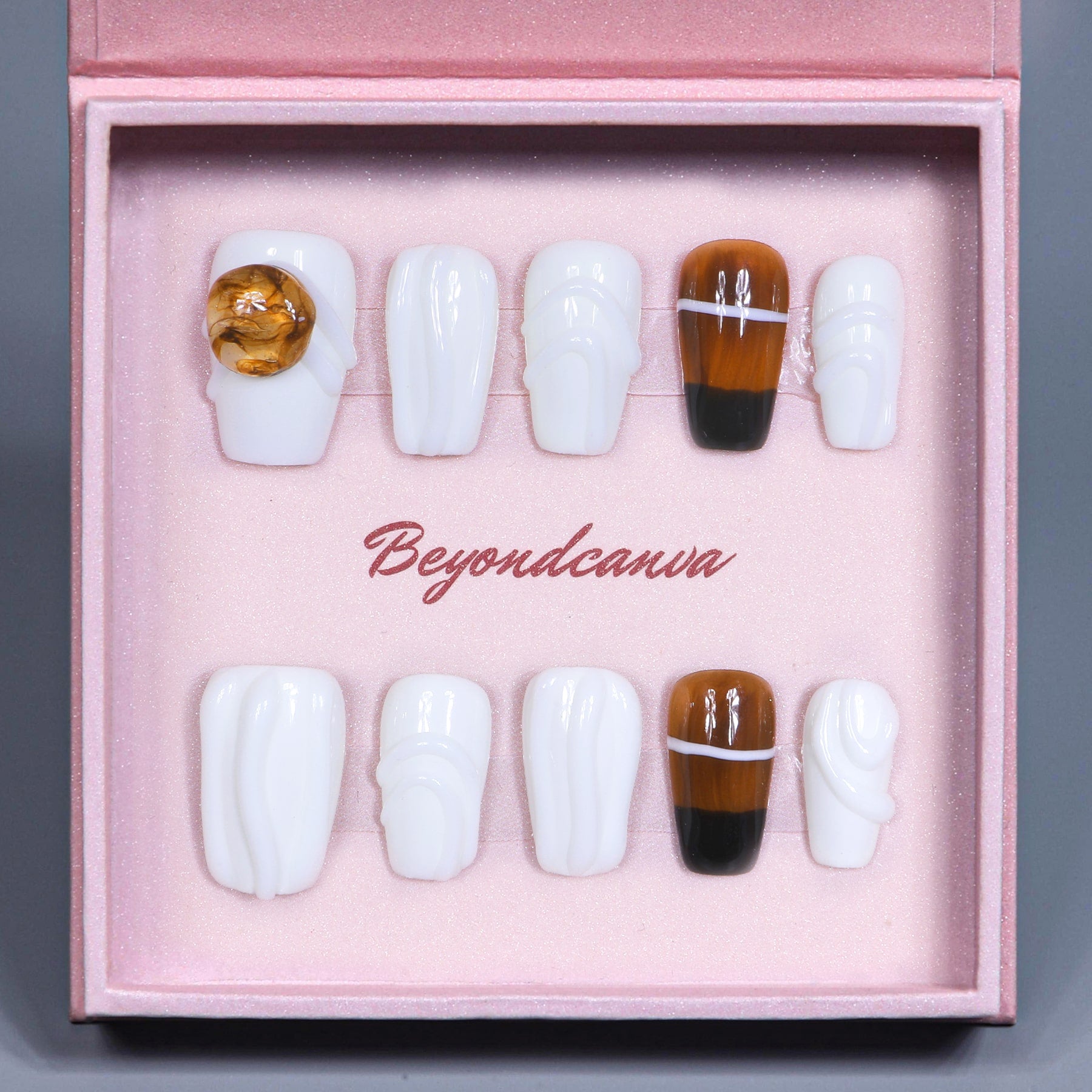 Beyondcanva elegant press-on nails with white swirls and amber accent, featuring minimalist design and premium finish for a chic look.