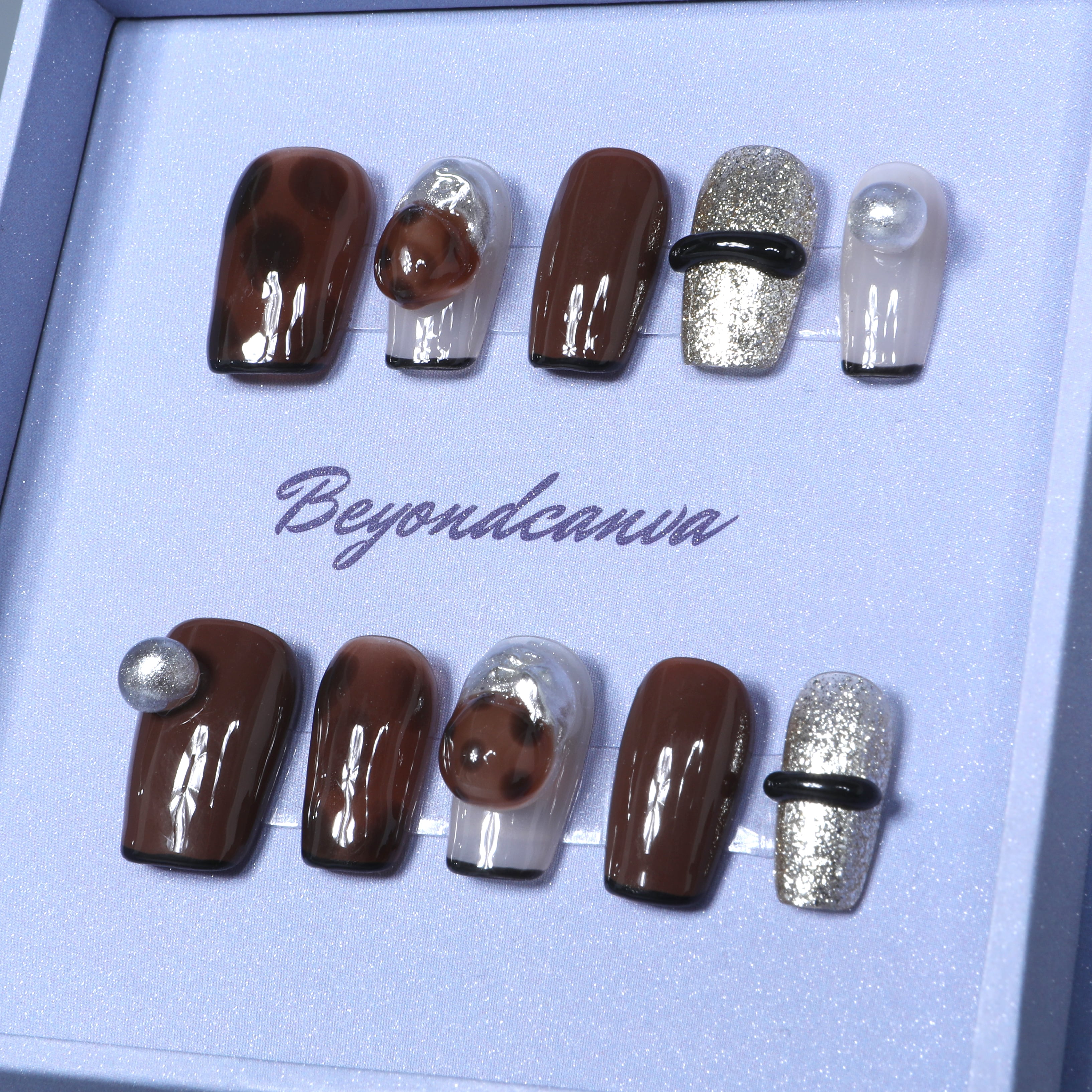 Elegant Beyondcanva press-on nails featuring rich coffee tones, glittery silver highlights, and modern accents for a chic, luxurious look.