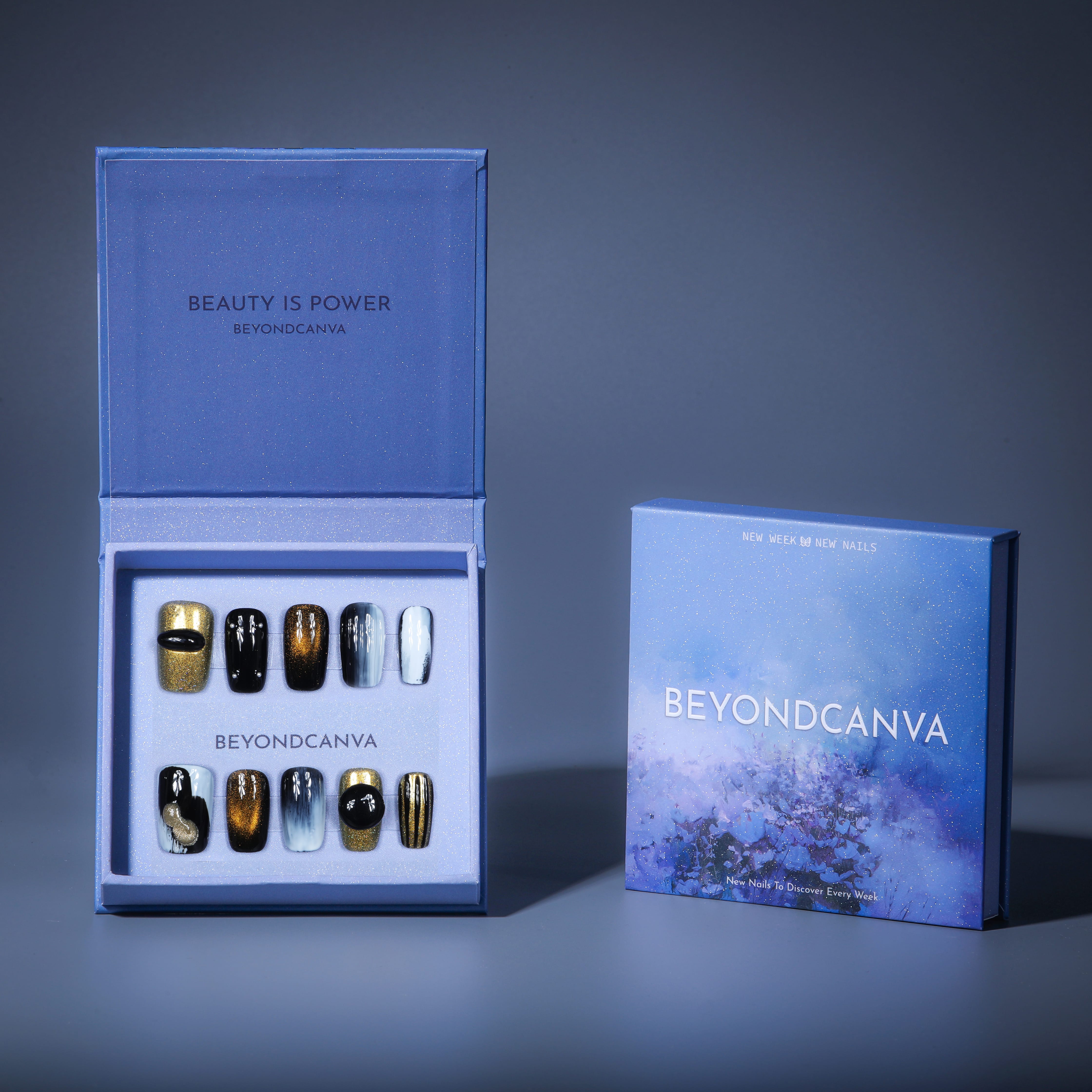 This beyondcanva press-on nail set features bold black, gold, and white tones with shimmering accents for a luxurious statement.