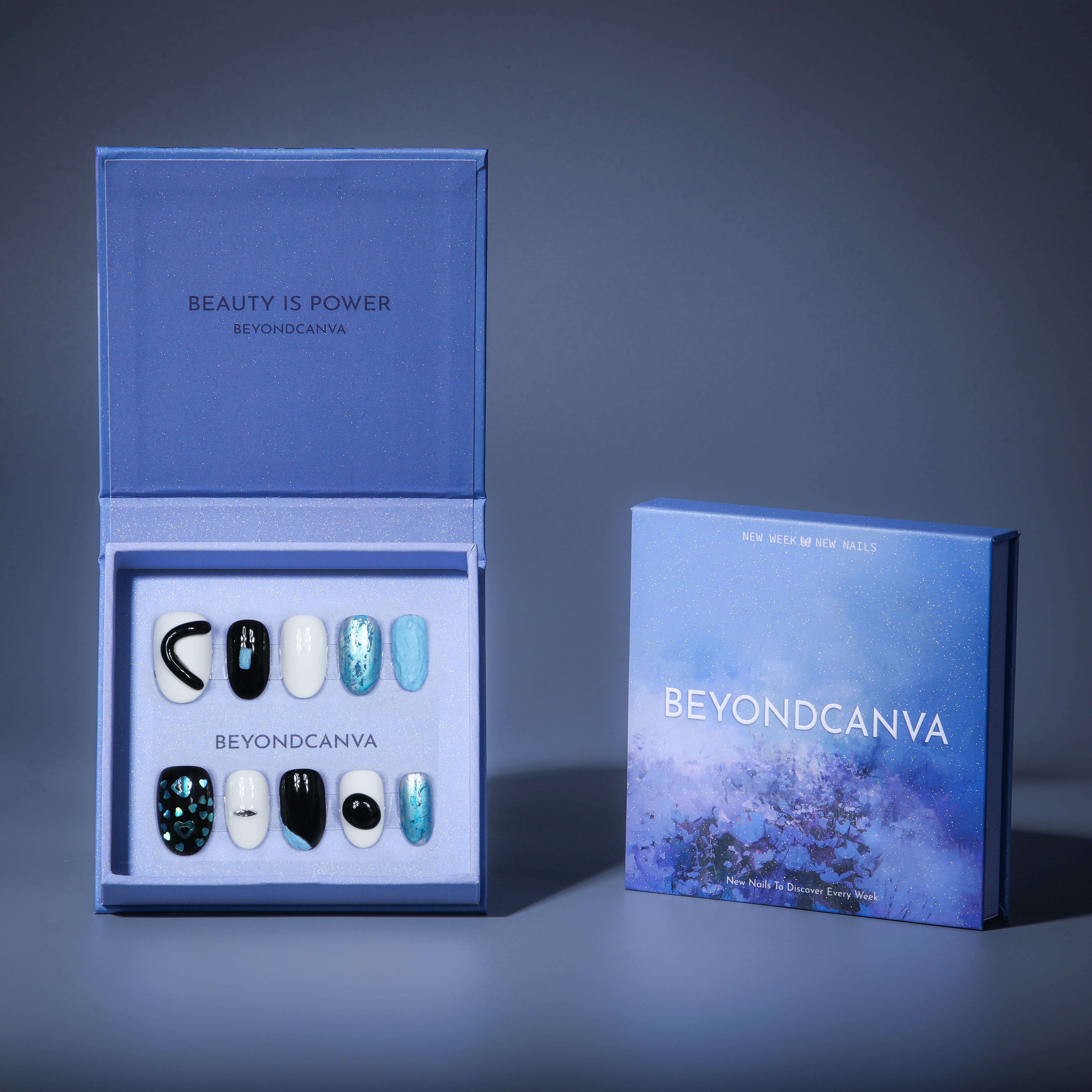 This beyondcanva press-on nail set features striking black, white, and blue tones with unique textures and holographic accents. Perfect for a bold, modern look.