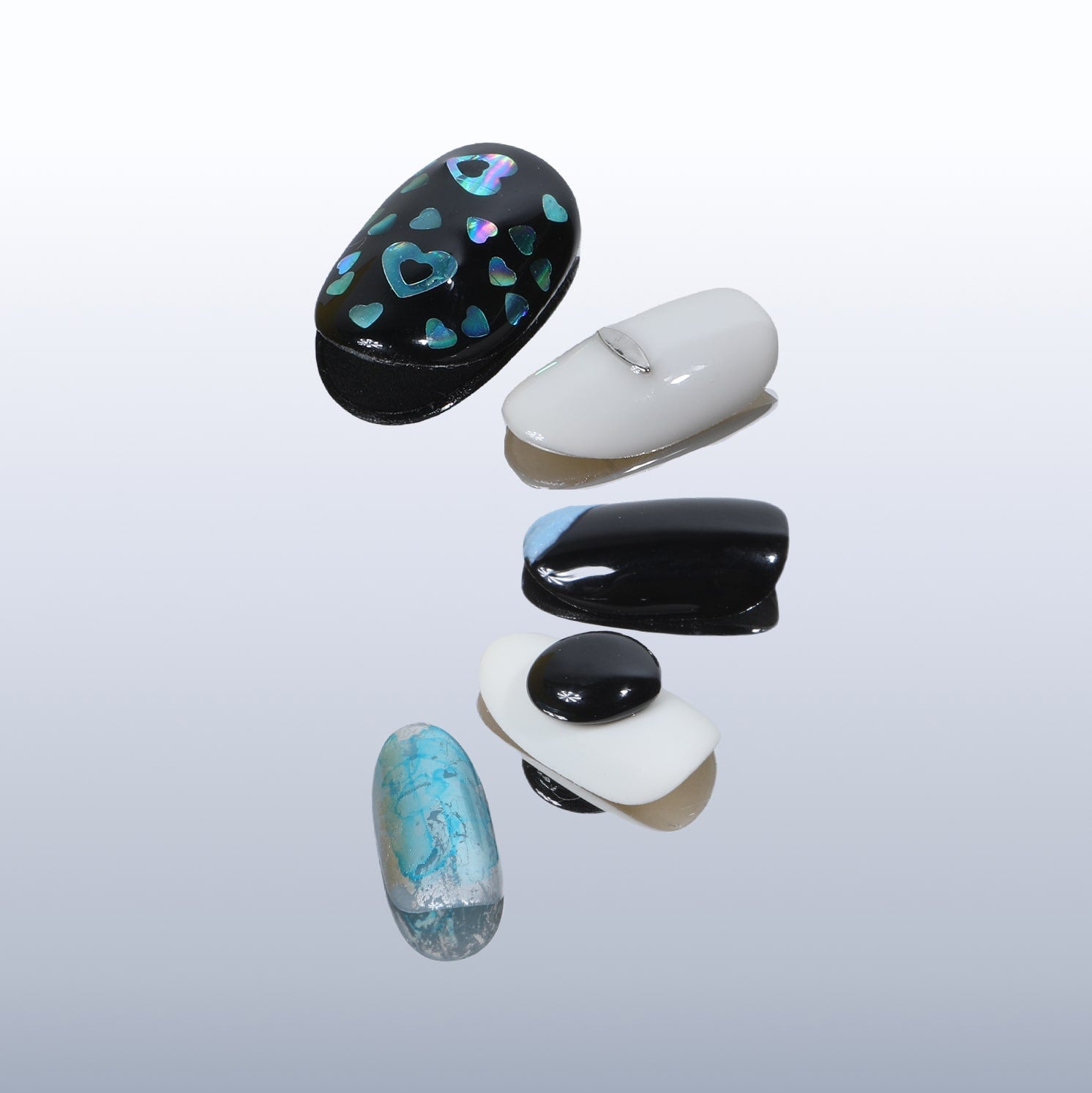 This beyondcanva press-on nail set features striking black, white, and blue tones with unique textures and holographic accents. Perfect for a bold, modern look.