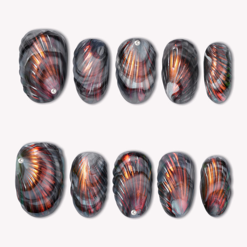 Set of handmade press-on nails with black, gray, and copper metallic fan patterns on a white flat lay.