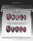 Handmade press-on nails displayed inside a clear BeyondCanva packaging box with black, gray, and copper metallic fan patterns.