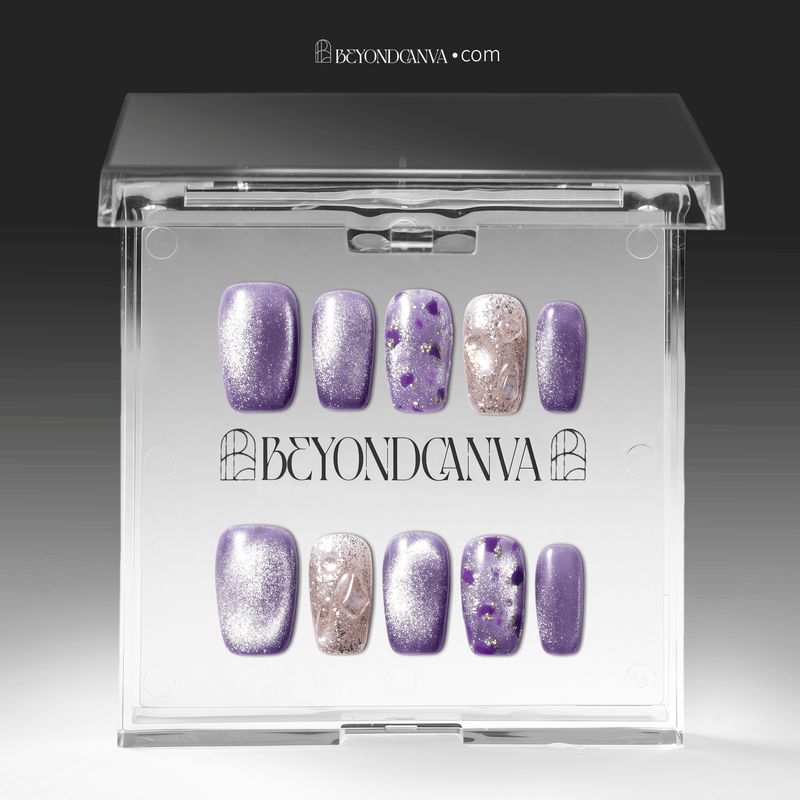 Packaging display of Amethyst Veil press-on nails in a clear Beyondcanva case with shimmering purple polish, silver glitter, and purple foil accents