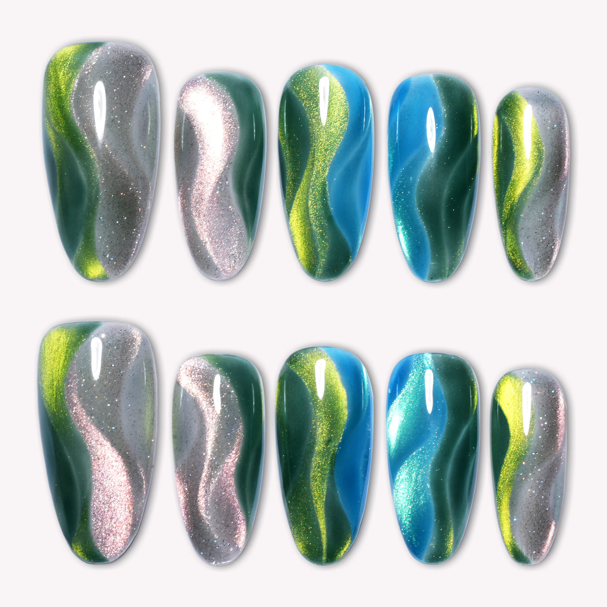 Green blue chrome press-on nails arranged in a flat lay