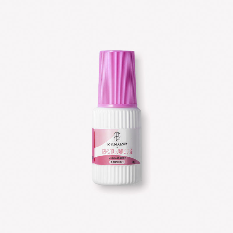 Beyondcanva brush-on nail glue bottle with a pink cap shown on a clean white background