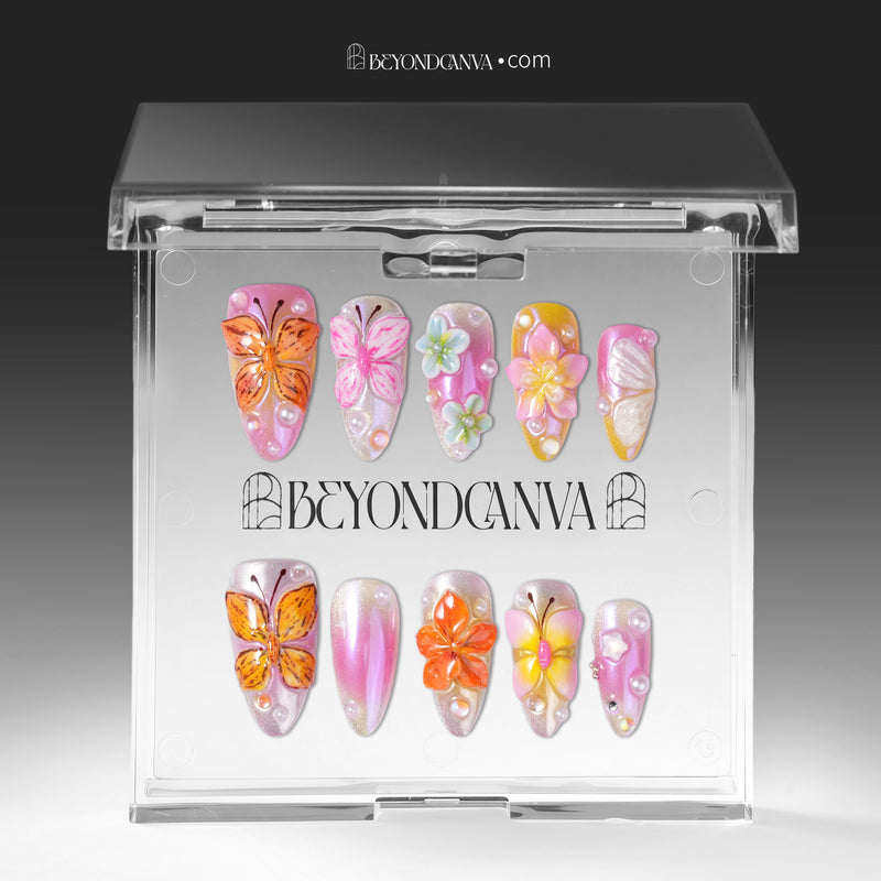 Bloom Pop pink butterfly and flower press-on nails arranged inside a clear Beyondcanva display case