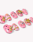 Bubblegum Pop Arcade handmade press-on nails arranged on a white background, showing pink plaid, gold accents, gems, and bow details.