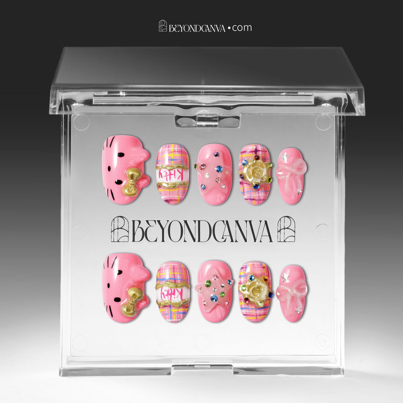 Bubblegum Pop Arcade handmade press-on nails displayed in clear packaging with a pink, plaid, gold, and gem-accented design.