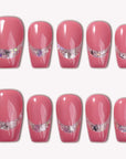 Candy Spark pink glossy press-on nails with a silver glitter accent stripe arranged on a white background
