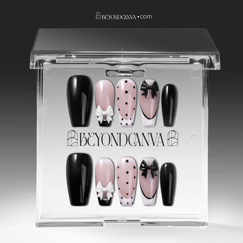 Packaging display of Chérie Noir press-on nails in a clear Beyondcanva case with glossy black nails, nude pink polka dots, black French outline, and raised bow designs