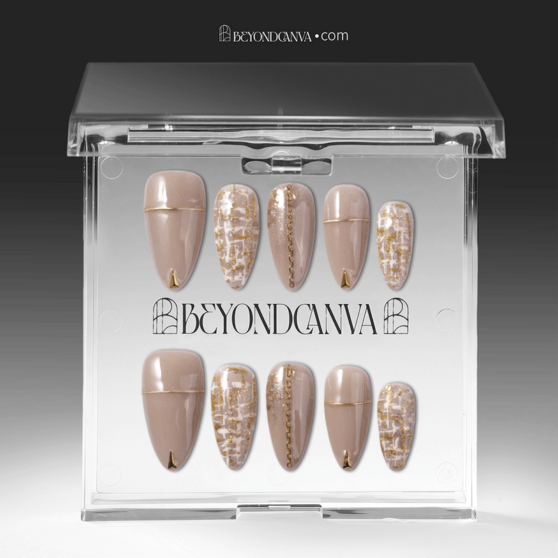 Packaging display of beige press-on nails with gold line accents, tweed plaid details, and glitter finish in a clear box