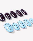 Angled flat lay of Choco Sky Dots press-on nails with glossy chocolate brown and sky blue bases plus contrasting polka dots