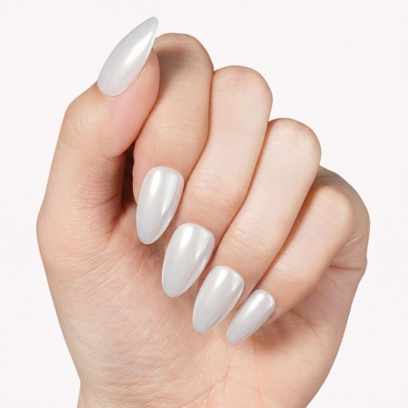Classic Daily Set press-on nails worn in a close-up hand pose with glossy white almond-shaped nails