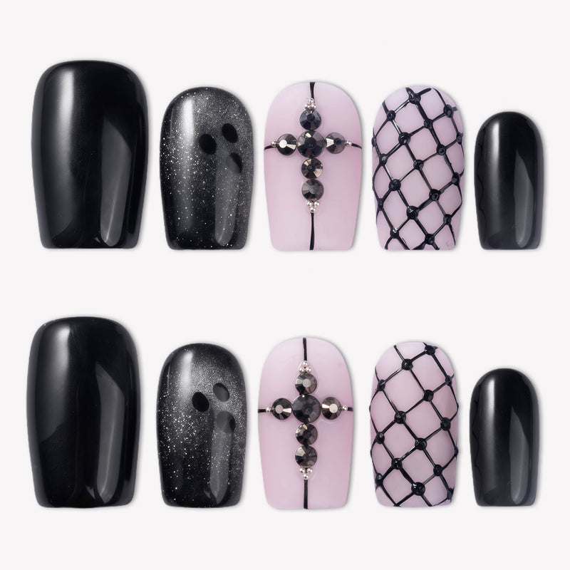 Dark Masquerade press-on nails with glossy black tips, pink nude bases, black rhinestone cross accents, and raised fishnet designs