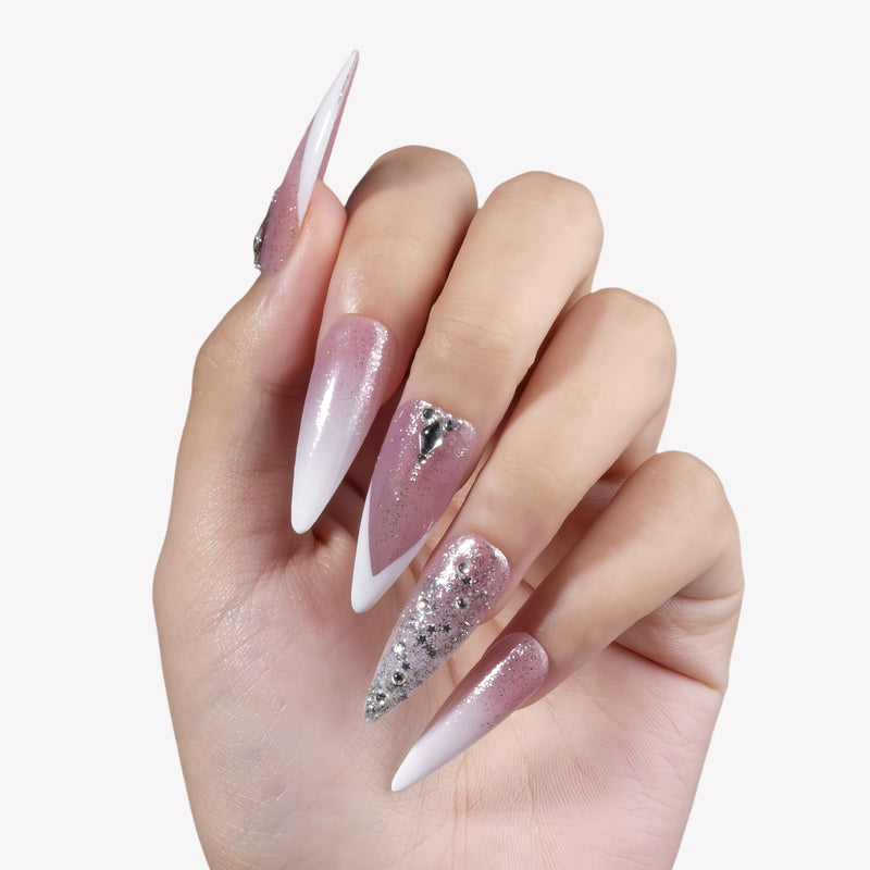 Diamond Dust long stiletto press-on nails with pink shimmer, white V tips, silver glitter, rhinestones, and crystal charms