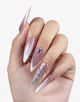 Diamond Dust long stiletto press-on nails with pink shimmer, white V tips, silver glitter, rhinestones, and crystal charms