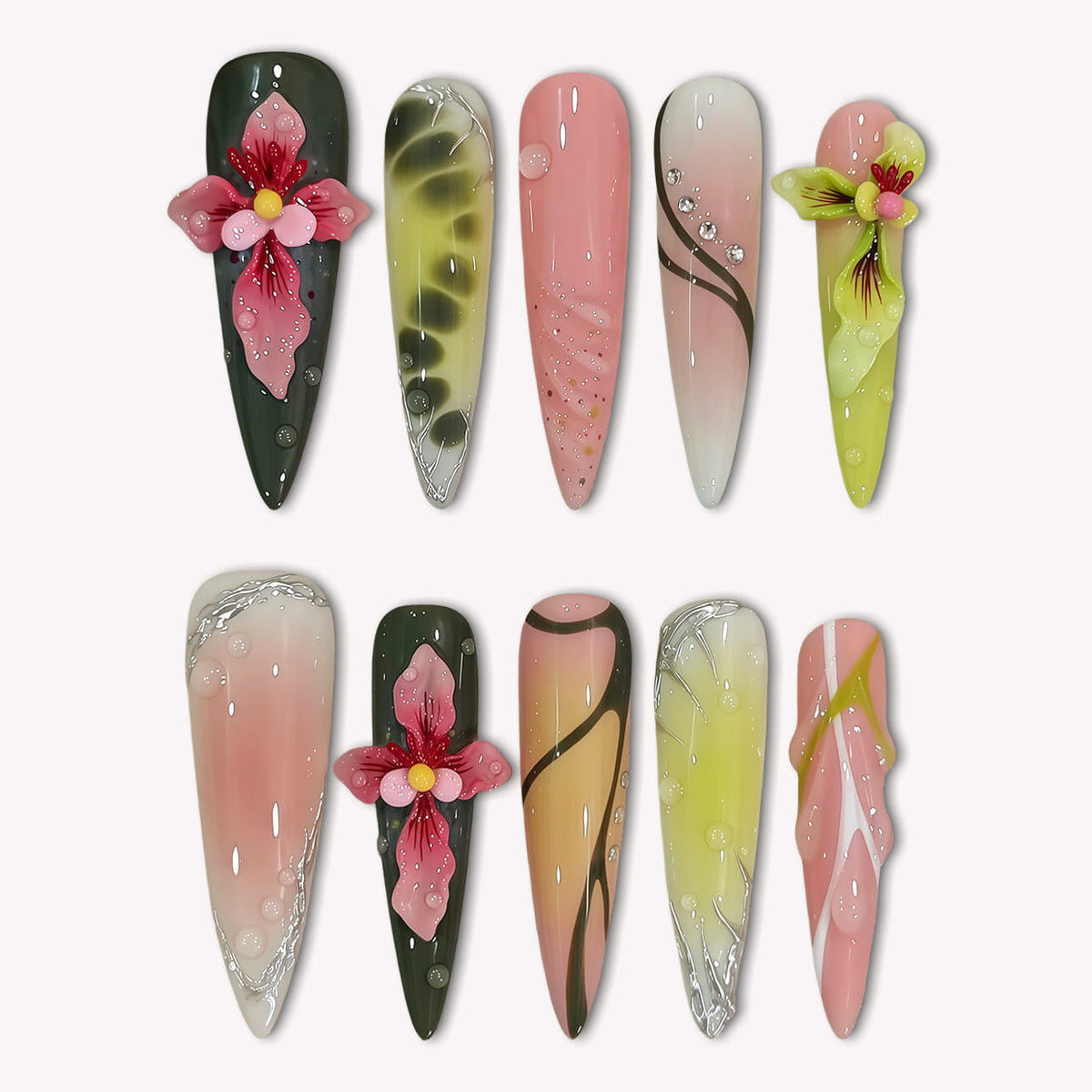 Flat lay of multicolor floral press-on nails with dark green, pink, yellow, and beige accents on a white background.