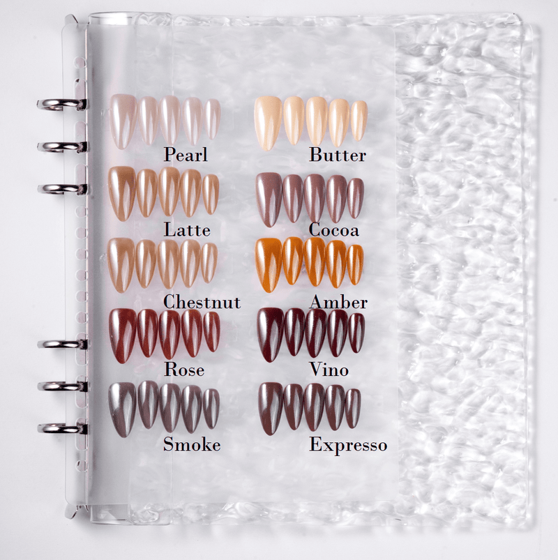 Fall Essence press-on nail color palette in a swatch book showing Pearl, Butter, Latte, Cocoa, Chestnut, Amber, Rose, Vino, Smoke, and Espresso shades