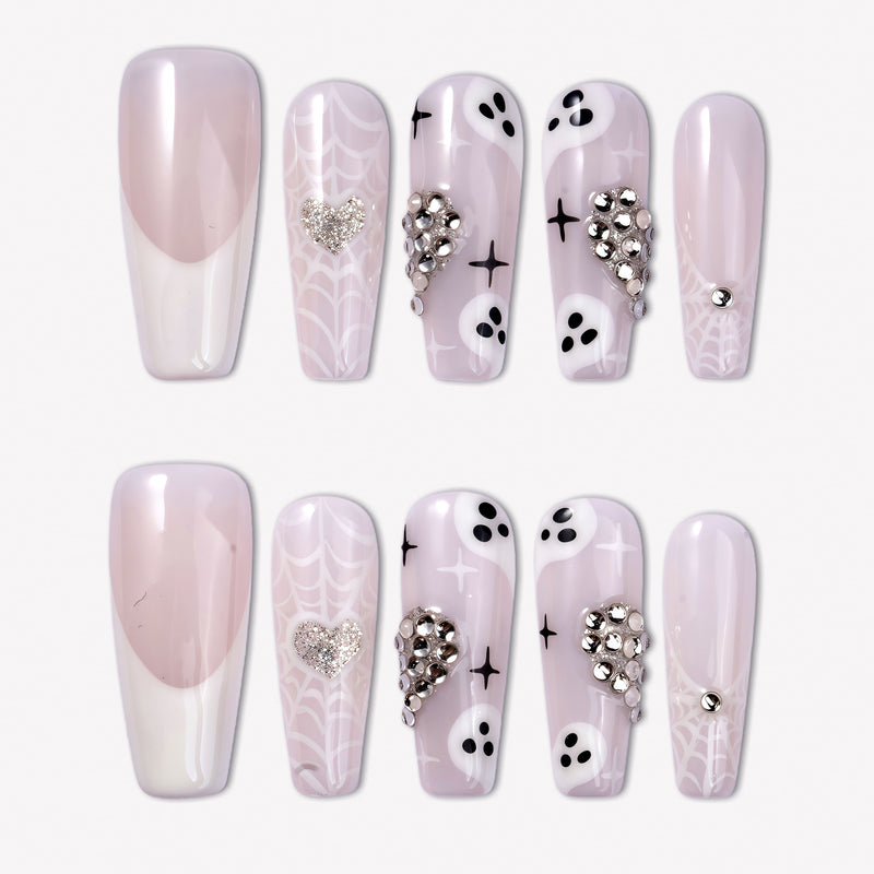 Ghosted Love press-on nails with pink translucent bases, white spider webs, ghost faces, silver heart rhinestones, and star accents