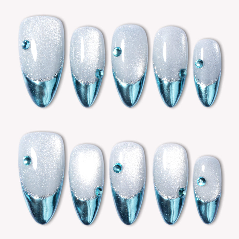 Silver and blue chrome press-on nails arranged in a flat lay
