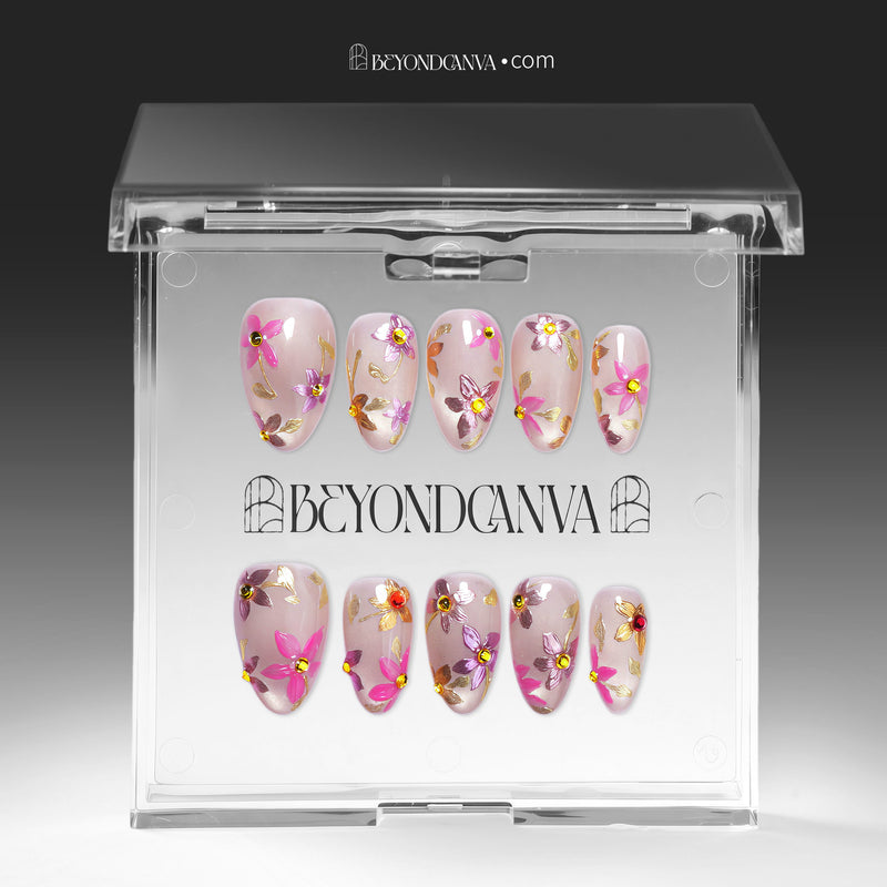 Pink floral cat-eye press-on nails displayed in packaging on a white background