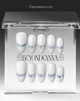 Press-on nails displayed in a clear BeyondCanva case with white nails and iridescent chrome shimmer accents.