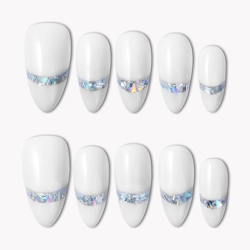 Flat lay of white press-on nails with iridescent chrome shimmer accents on a white background.