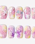 Impressionist Pointe press-on nails with pink and yellow gradients, 3D flowers, pearls, and bow accents