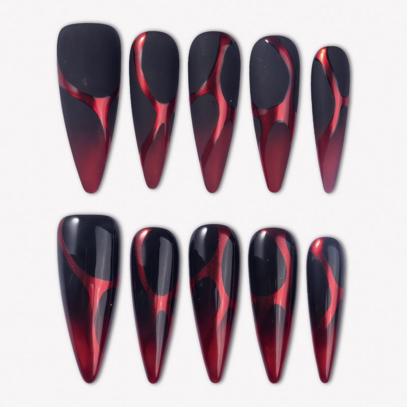 Inferno Veins press-on nails with black and deep red gradient stiletto tips, glossy and matte finishes, and red vein-like designs