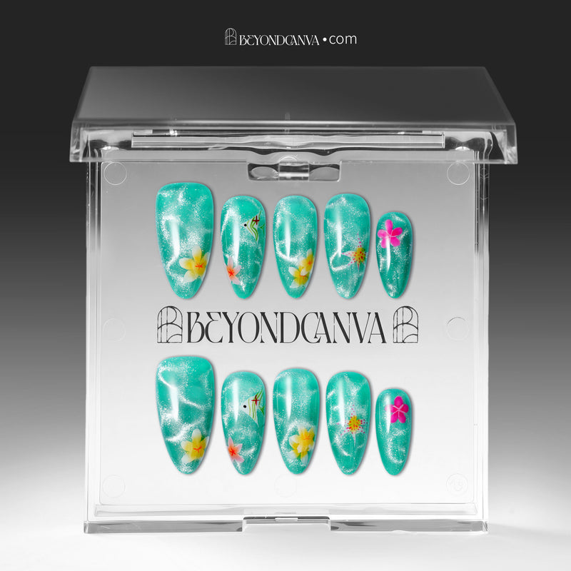 Press-on nails displayed inside a clear BeyondCanva case with turquoise glitter floral nails
